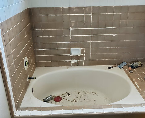 Worn ceramic tile shower before professional reglazing