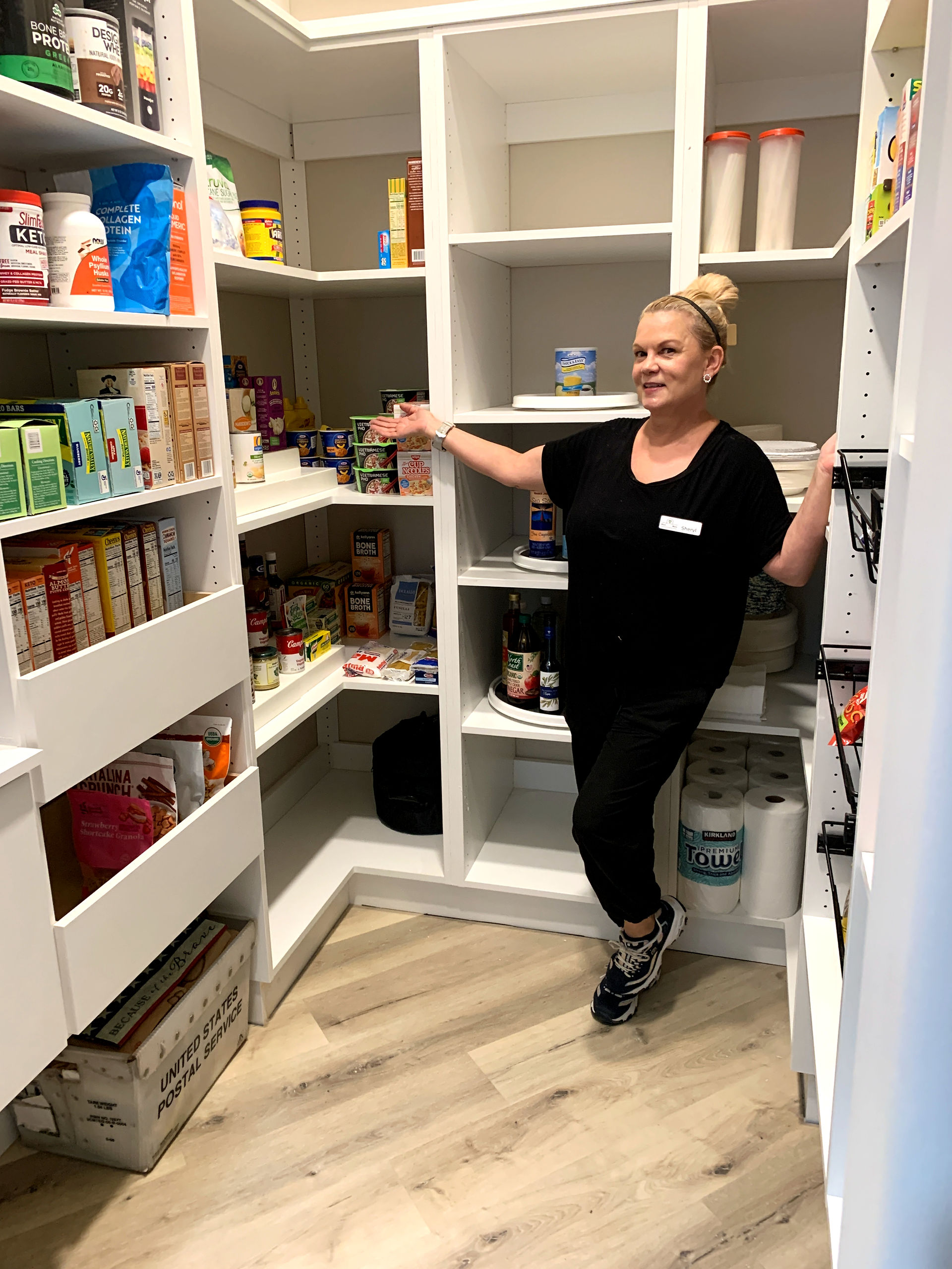 organized pantry with women showcasing