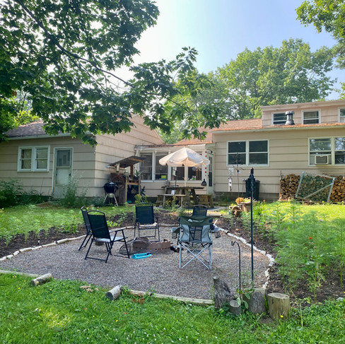 Our home after restoration—windows fixed, gardens blooming, and the space visibly nurtured with care and intention.