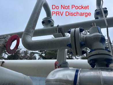 This PRV discharge line is located below the flare header with no weep hole for drainage