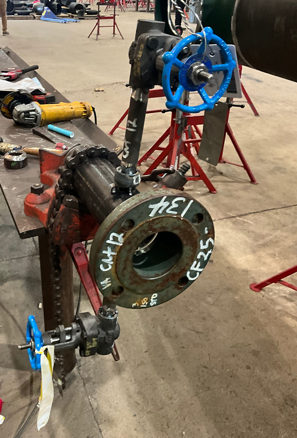The piping spool is being fabricated in a shop.