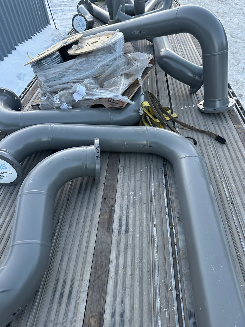 Pre-fabricated piping spools arriving on-site after a 2000-mile journey.