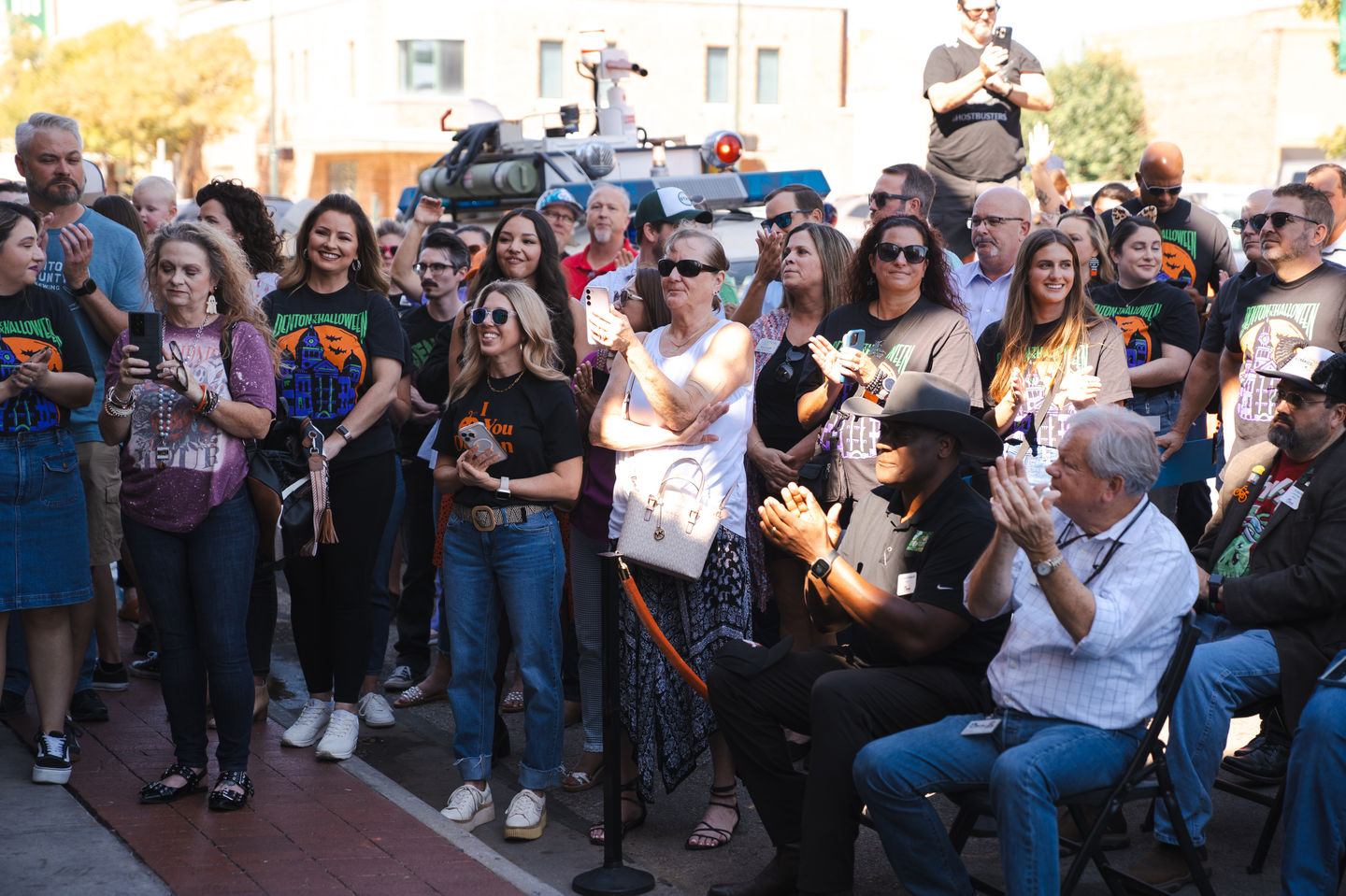 A crowd of people celebrating the launch of Denton Halloween