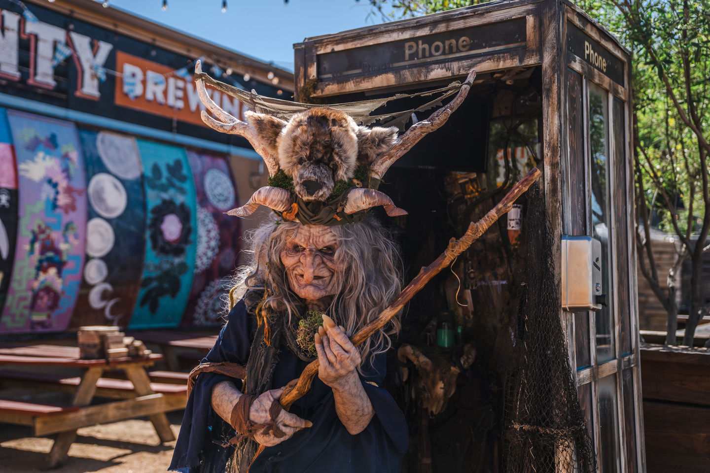 Person dressed as a witch for Halloween at Denton County Brewing Company