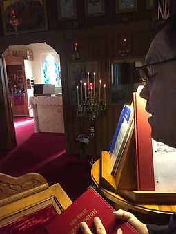 Church interior at sunset, candles, sing