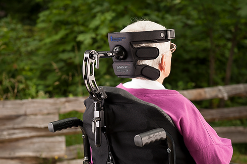 Woman in wheelchair with her head supported in a Savant Headrest
