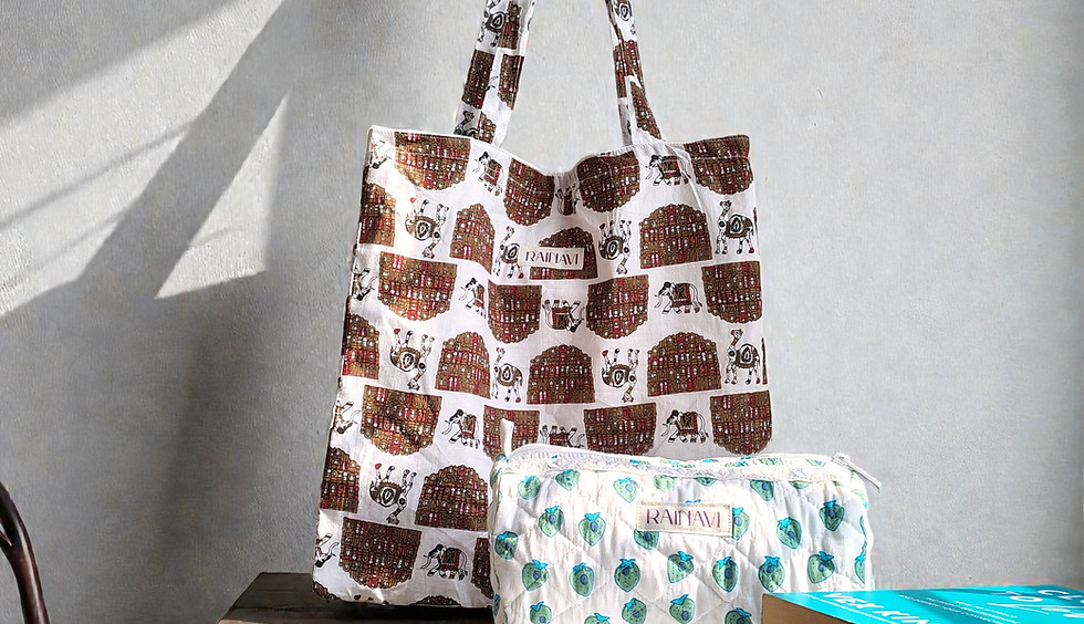 Brown patterned tote bag and green patterned pouch on a wooden table