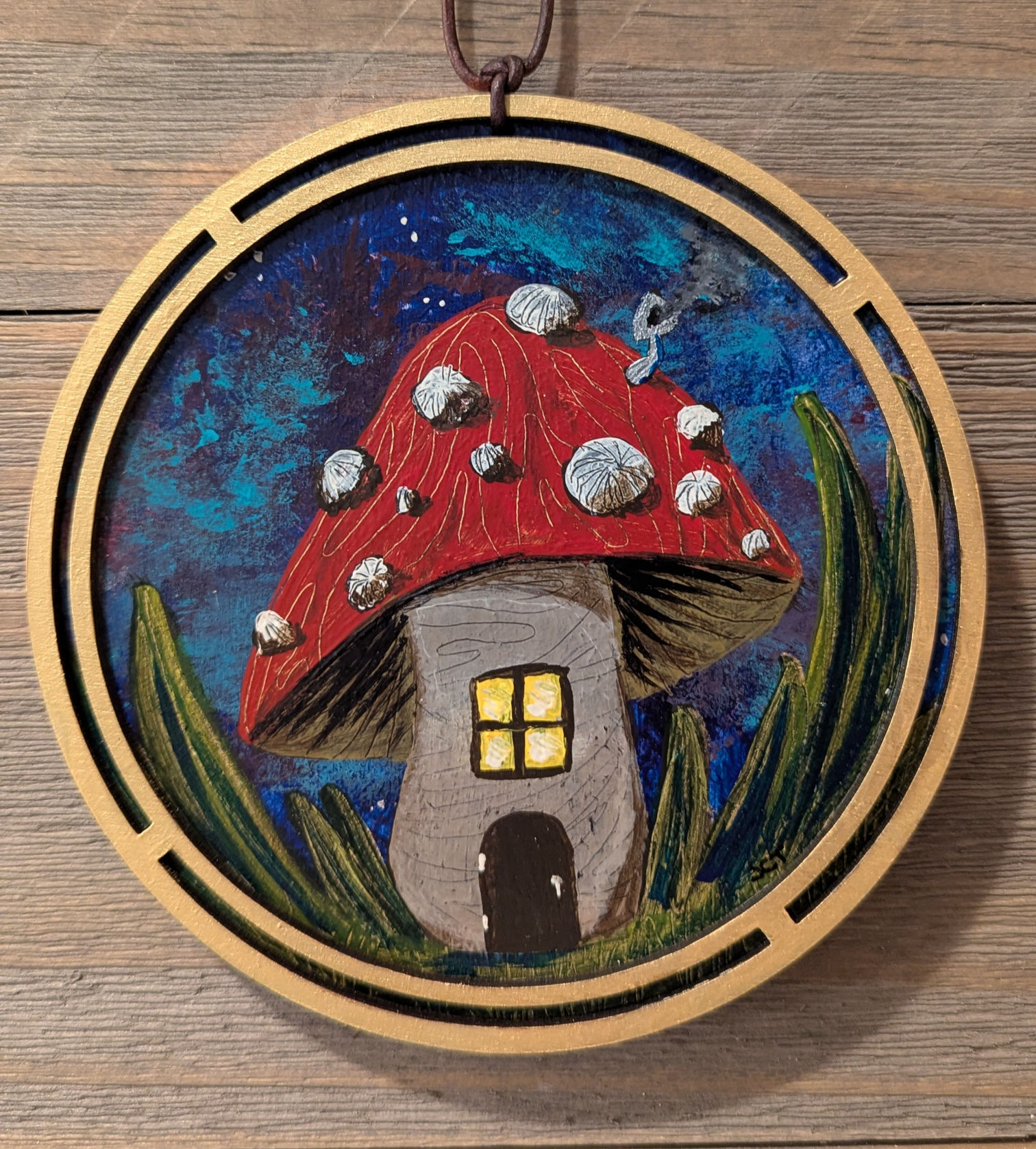 Hand‑painted mushroom house art with a glowing cottage and night sky