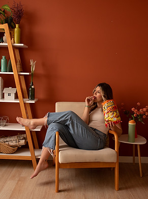 A girl sitting on the couch looking up