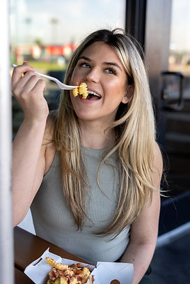 french fry in her mouth