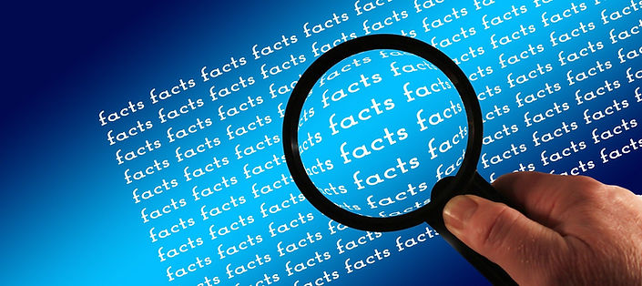 Magnifying glass looking for facts in a report card