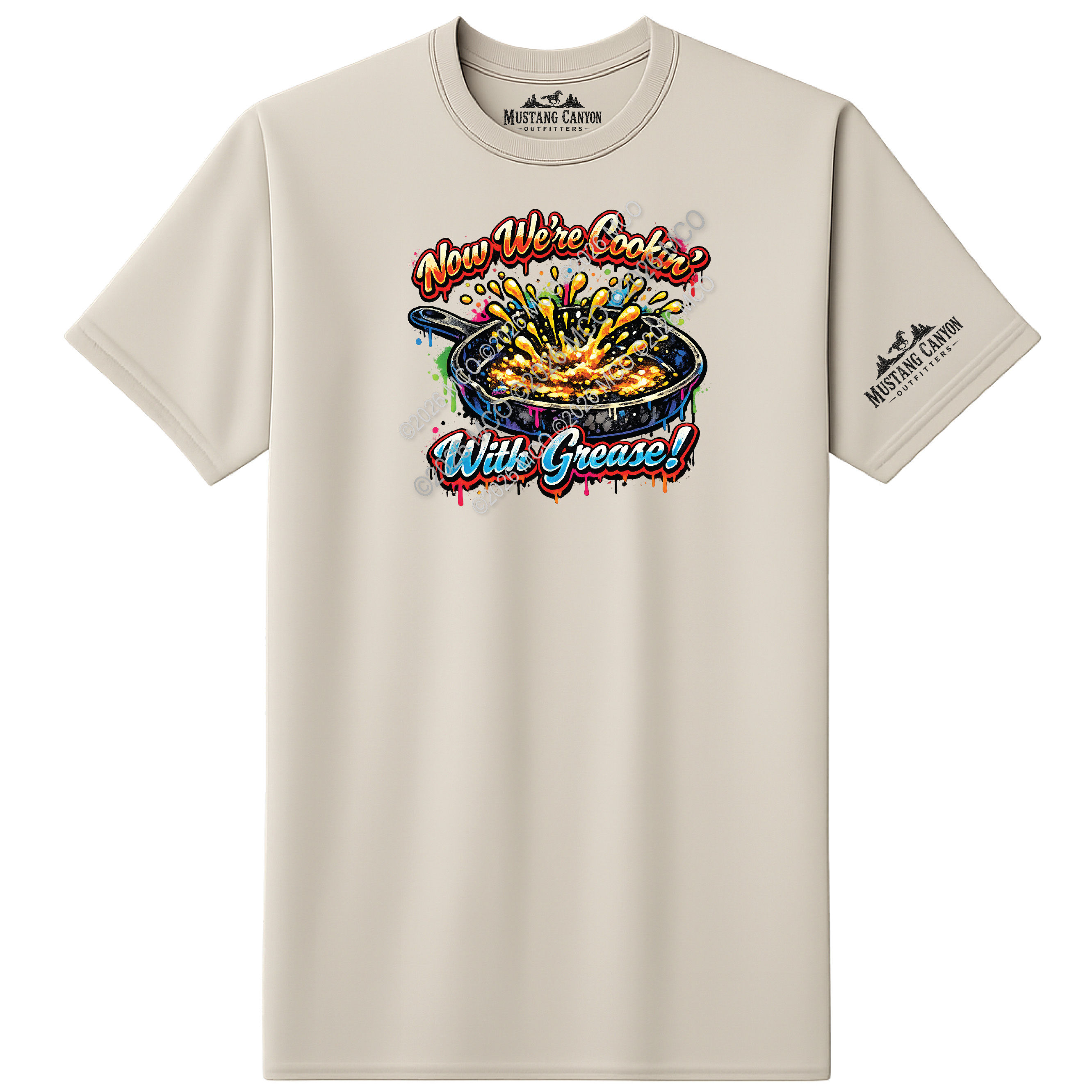 sand shirt with grease popping in a cast iron skillet