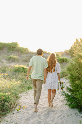 wilmington nc north carolina wedding photographer engagement wrightsville beach manor south end black and white elegant sunset evening floral dress bouquet picnic spring styled
