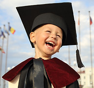 Happy child succeeding academiclaly after attending our online primary school.