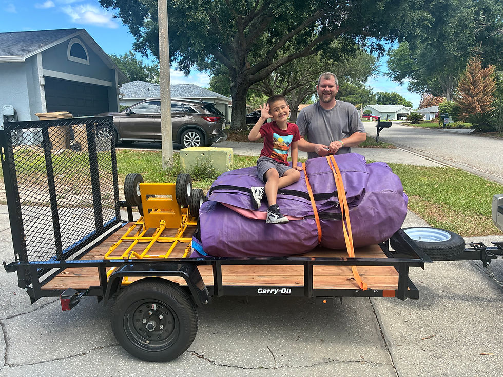 Co-owner Chris Smith & son Kiloh loading the trailer.
