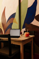 Enjoying a coconut while getting work done, tropical mural