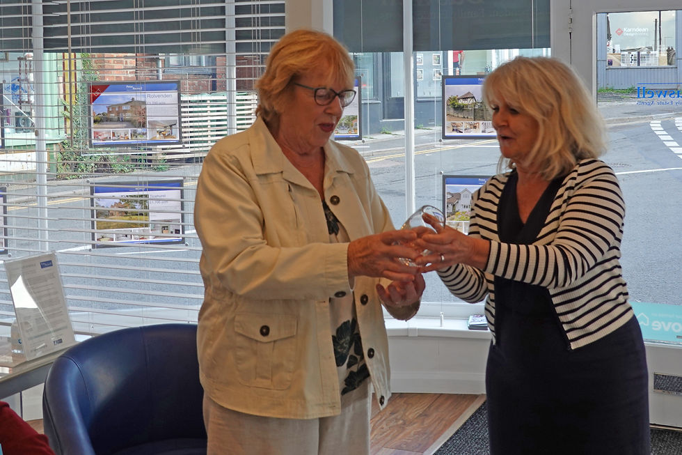 Shirley receiving the prize