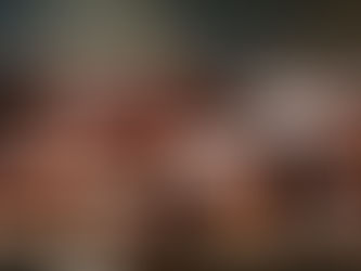 A sophisticated collection of accessories featuring a sleek leather wallet, a stylish straw tote bag with leather handles, and an elegant tan leather handbag, all illuminated by soft natural lighting.