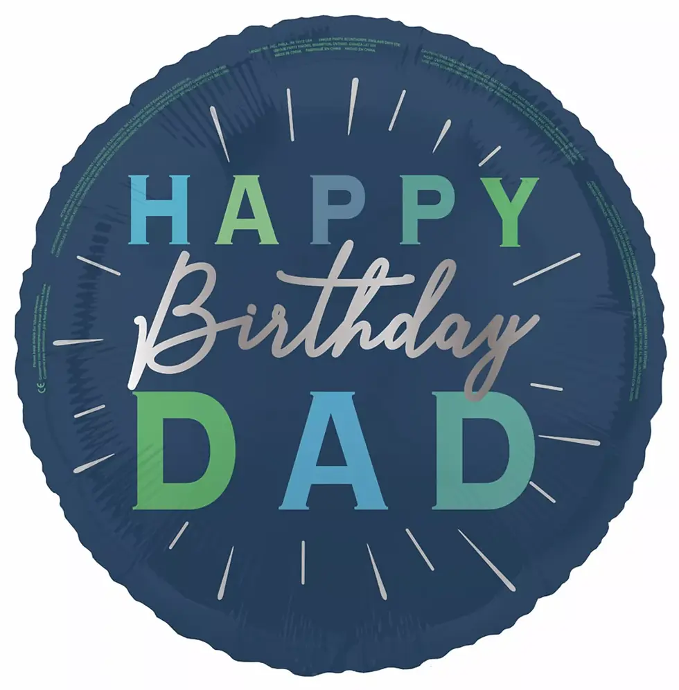 Round dark blue foil balloon with 'Happy Birthday Dad' in green, blue, and silver letters, with radiating lines around the te