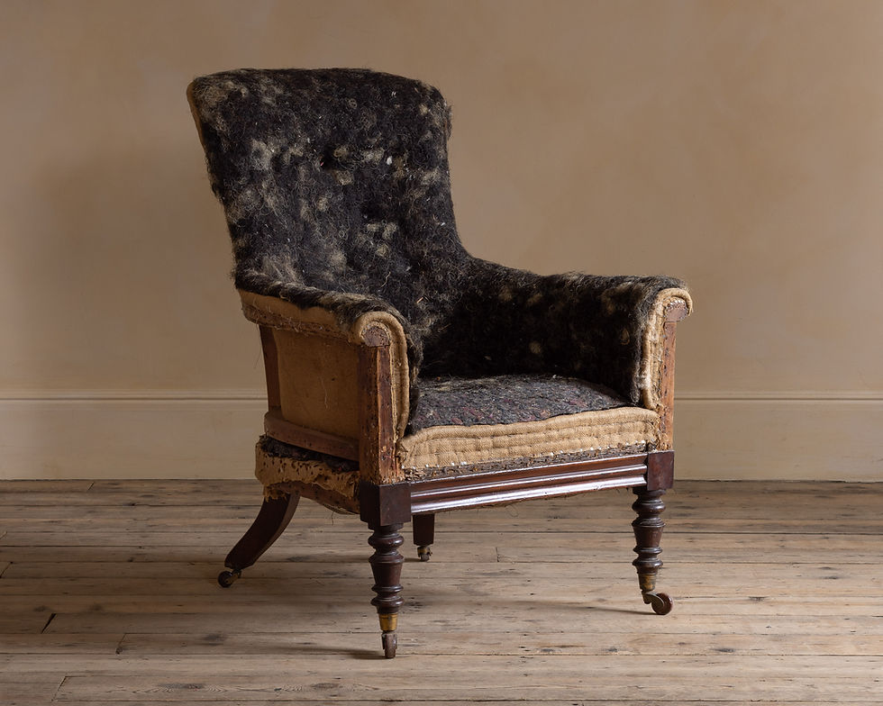 A 19th century upholstered mahogany armchair
