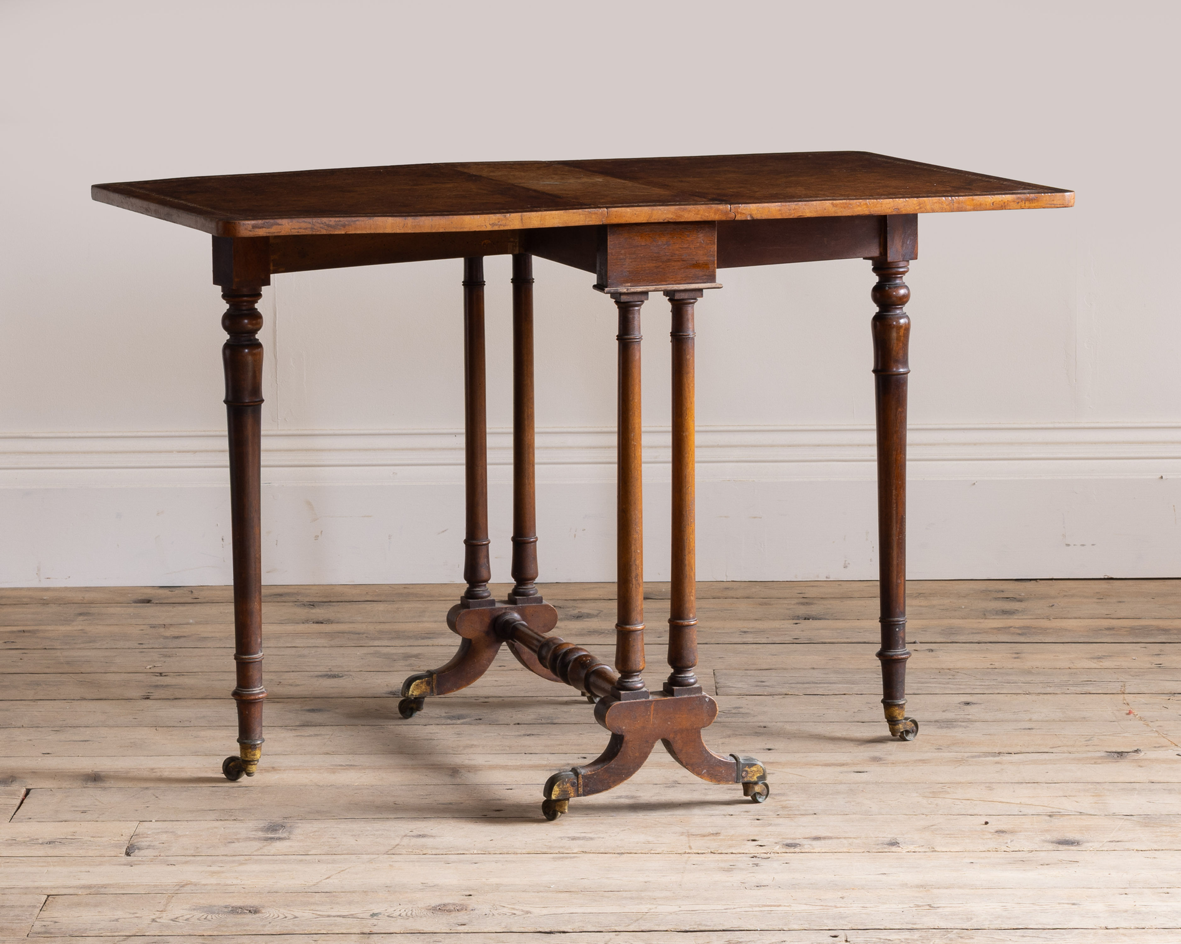 A Victorian walnut sutherland table