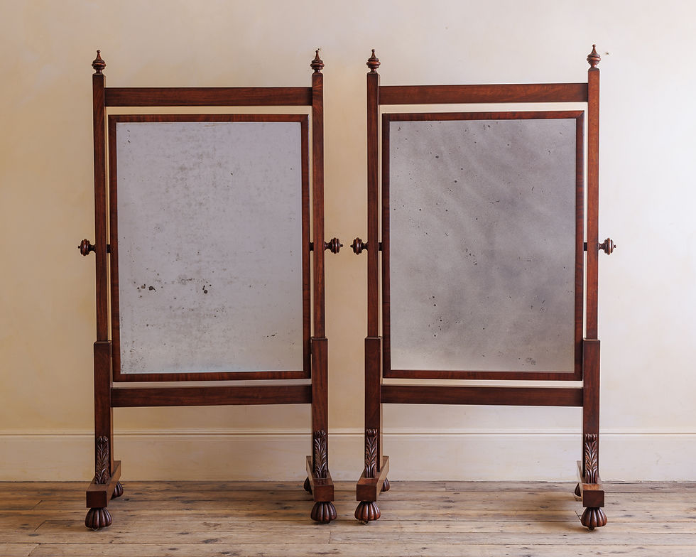 A pair of George IV mahogany cheval mirrors