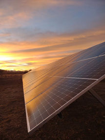 Sunset with solar panels by Steel City Solar