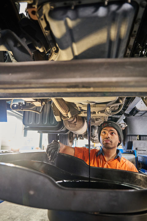 Technician draining oil beneath a vehicle during servicing at a transport refrigeration facility.
A TRS technician servicing a road transport refrigeration unit beneath a vehicle at a Sydney manufacturing facility. Maintenance work underway at TRS Sydney, Australia’s largest manufacturer of road transport refrigeration systems, with a technician servicing equipment beneath a vehicle. A TRS technician inspecting and servicing a road transport refrigeration system beneath a vehicle at the Sydney facility, highlighting precision manufacturing and hands-on expertise. Road transport refrigeration servicing in progress at TRS Sydney, Australia’s largest manufacturer in the sector. Diesel machinic. draining sup oil