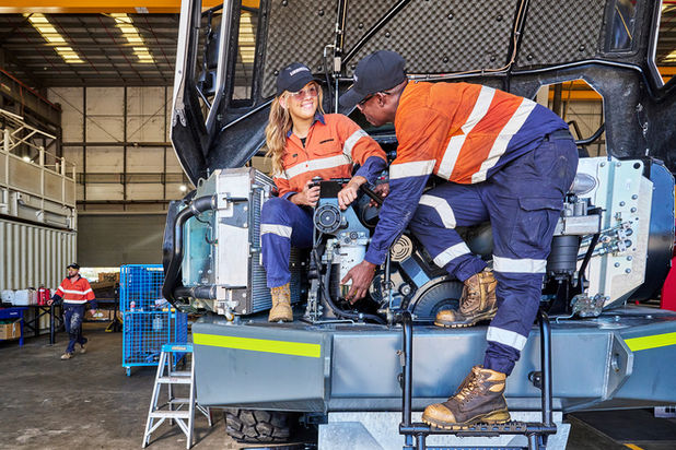Diesel mechanics, high-visibility shirts, safety boots, tools, grease, machinery, workshops, parts, boardrooms, classrooms.  Liebherr excavator images, Liebherr machine photography, Liebherr earthmoving equipment Construction site with Liebherr machines Liebherr equipment in action