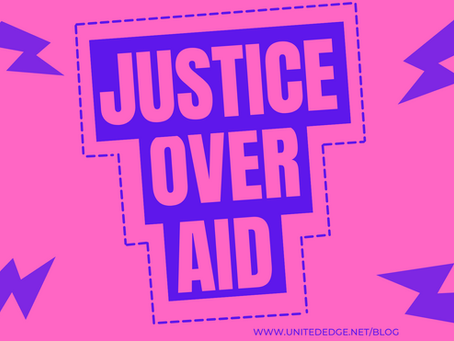 A bright pink background with lightening bolts and the words 'Justice Over Aid'