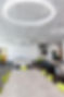 A spacious conference room filled with tables and chairs