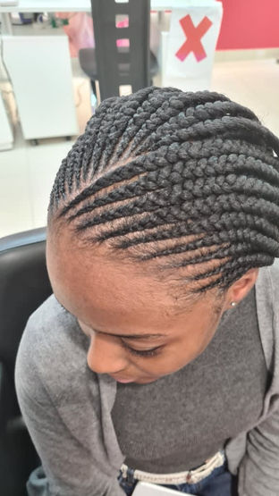 top of lady's head with afro hair