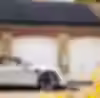 White electric car charging via sleek EV charging installation on brick wall.