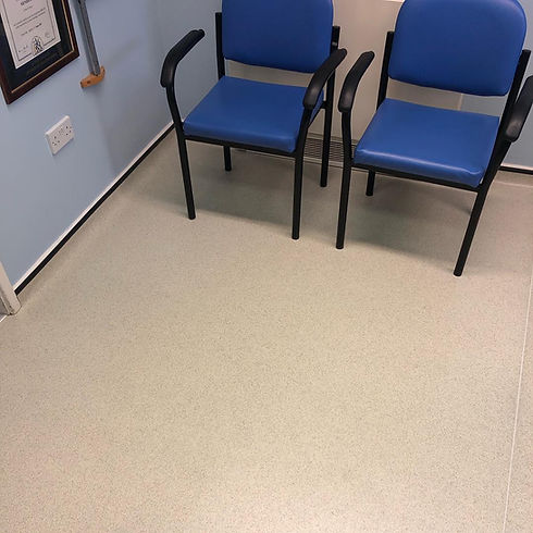 Blue chairs in communal waiting room