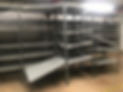 A spacious warehouse filled with numerous shelves
