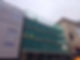 Building exterior with green scaffold netting
