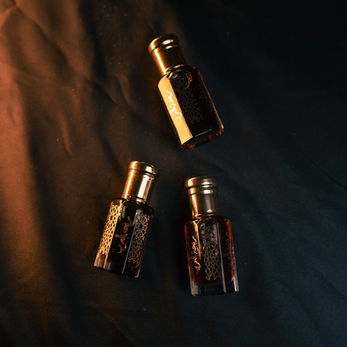 3 Arabic perfumes on a dark background