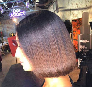 A sleek bob haircut showcased in a stylish salon environment