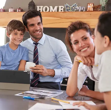 A cheerful family gathered around a table