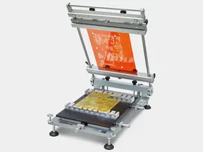 Desktop stencil printer machine open and prepared for paste medium application