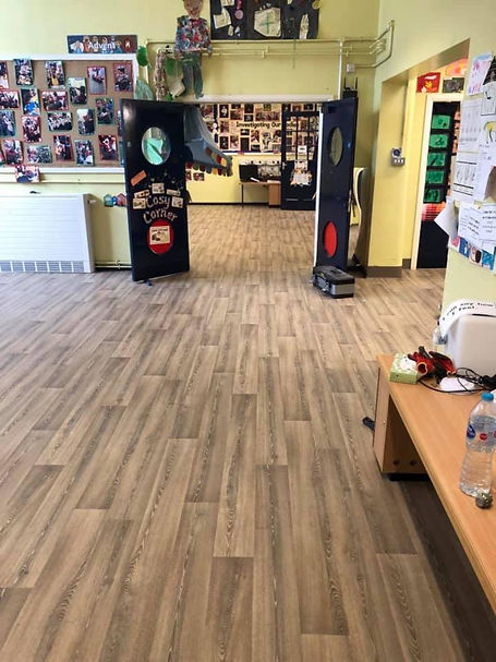 A colourful classroom or play area with light wood-effect flooring