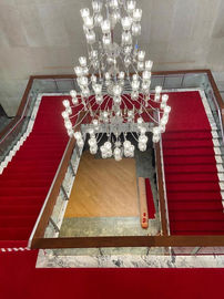 Red staircase runner on double sided marble staircase