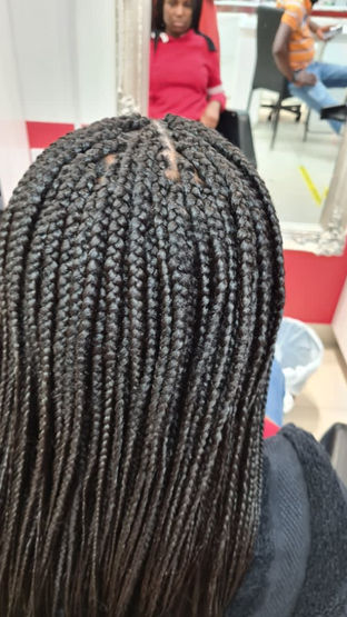 back of lady's head with afro hair