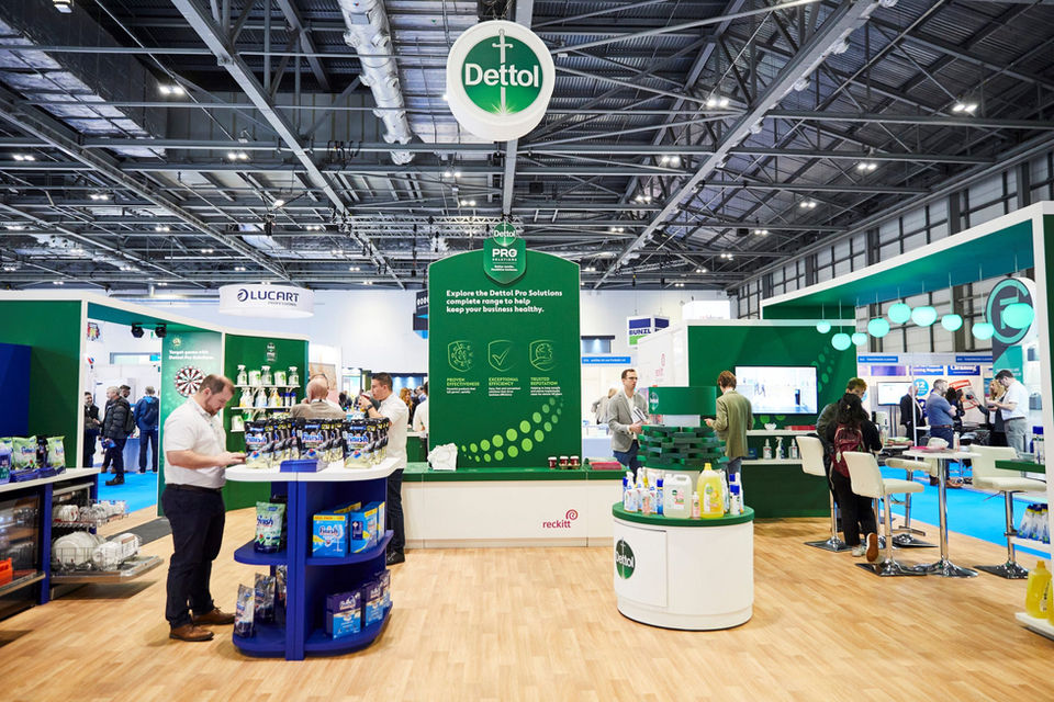 Exhibition booth with Dettol branding, displaying cleaning products