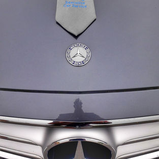 A KWC tie on the hood of a Mercedes-Benz