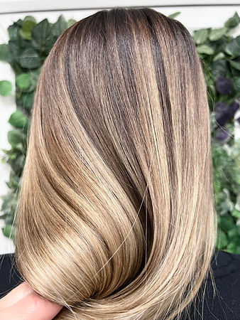 Smooth blonde hair with a light brown base