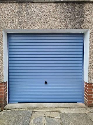 A closed blue garage door with horizontal panels