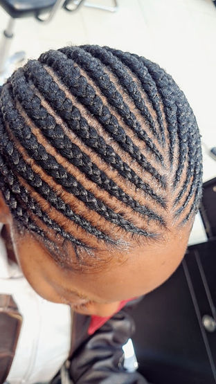 top of young lady's head with afro hair
