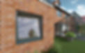 Modern tilt-and-turn window in a red brick house