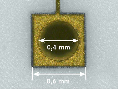 Close-up technical dimension preview detailing small square gold landing pad trace
